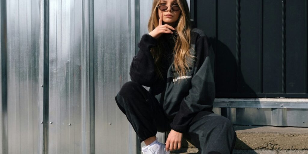 Woman wearing matching black sweatpants and top
