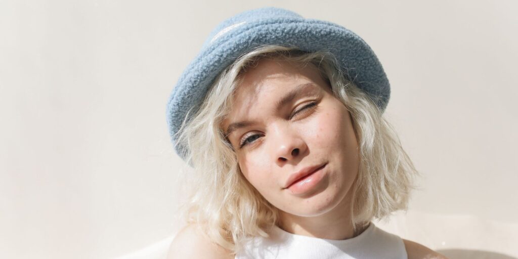 Blonde teen wearing a cute hat