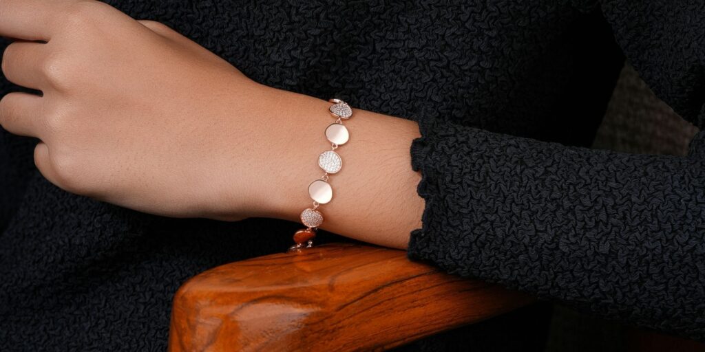 A womans wrist adorned with a van cleef bracelet