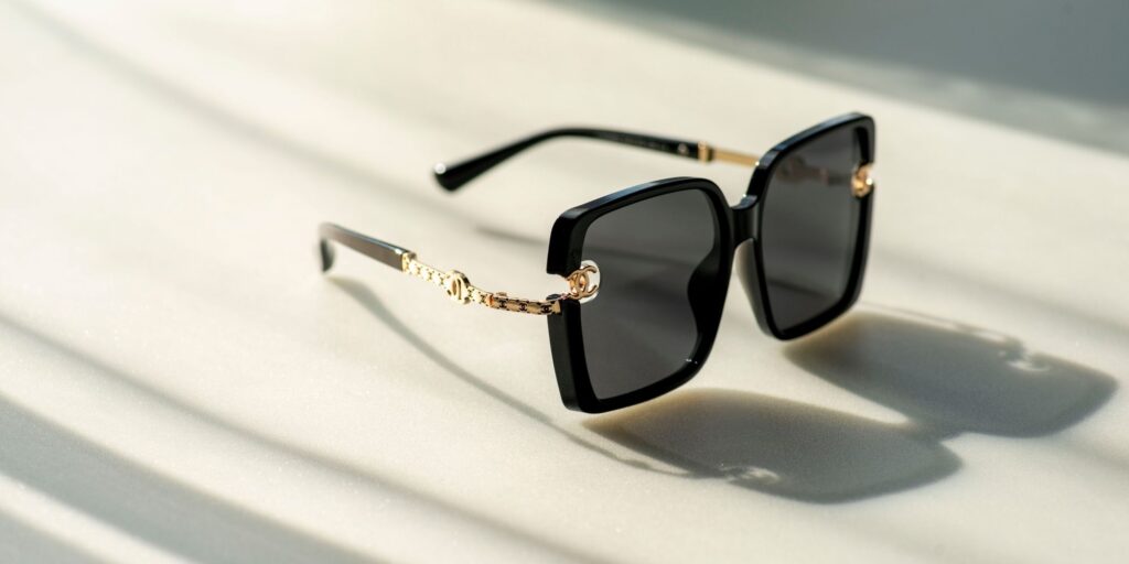 A pair of wide-frame Prada sunglasses from  fashionphile