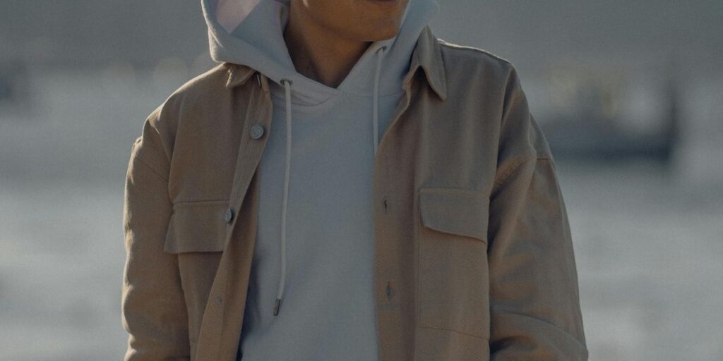 Jacob Elordi wearing a hoodie and coat combo