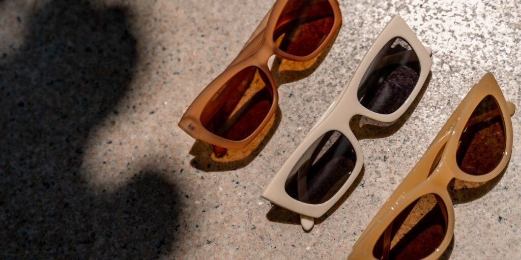 three pairs of womens sunglasses
